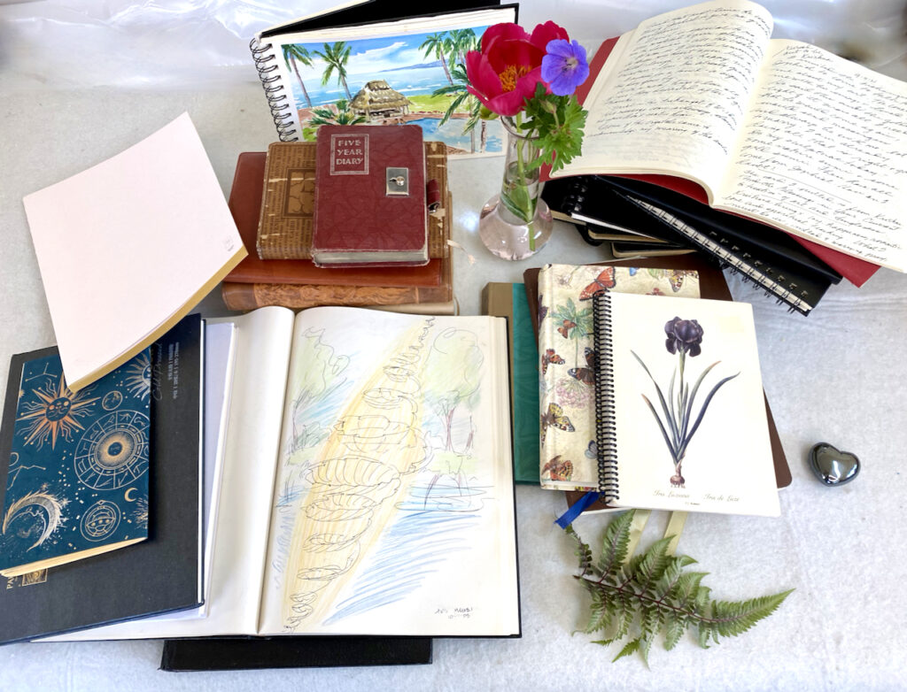Stack of Journals and Sketchbooks by Marilyn Wells,  "Journals and Sketchbooks to Find Signs to Hope, Peace and Joy."